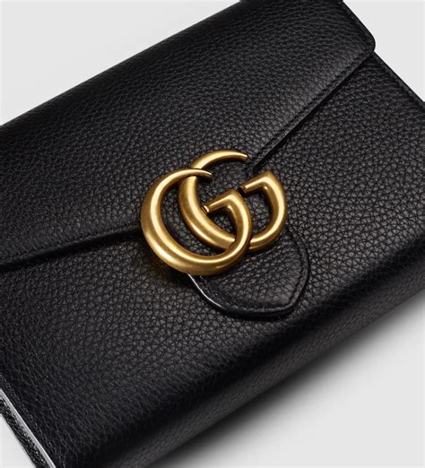 GG Marmont leather wallet on chain in black .